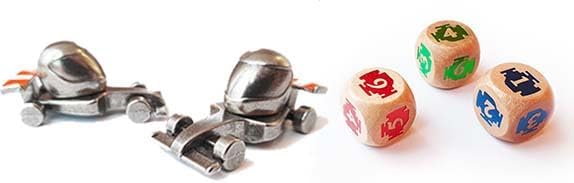 Two metallic robot figures and three dice with colorful faces on a white background